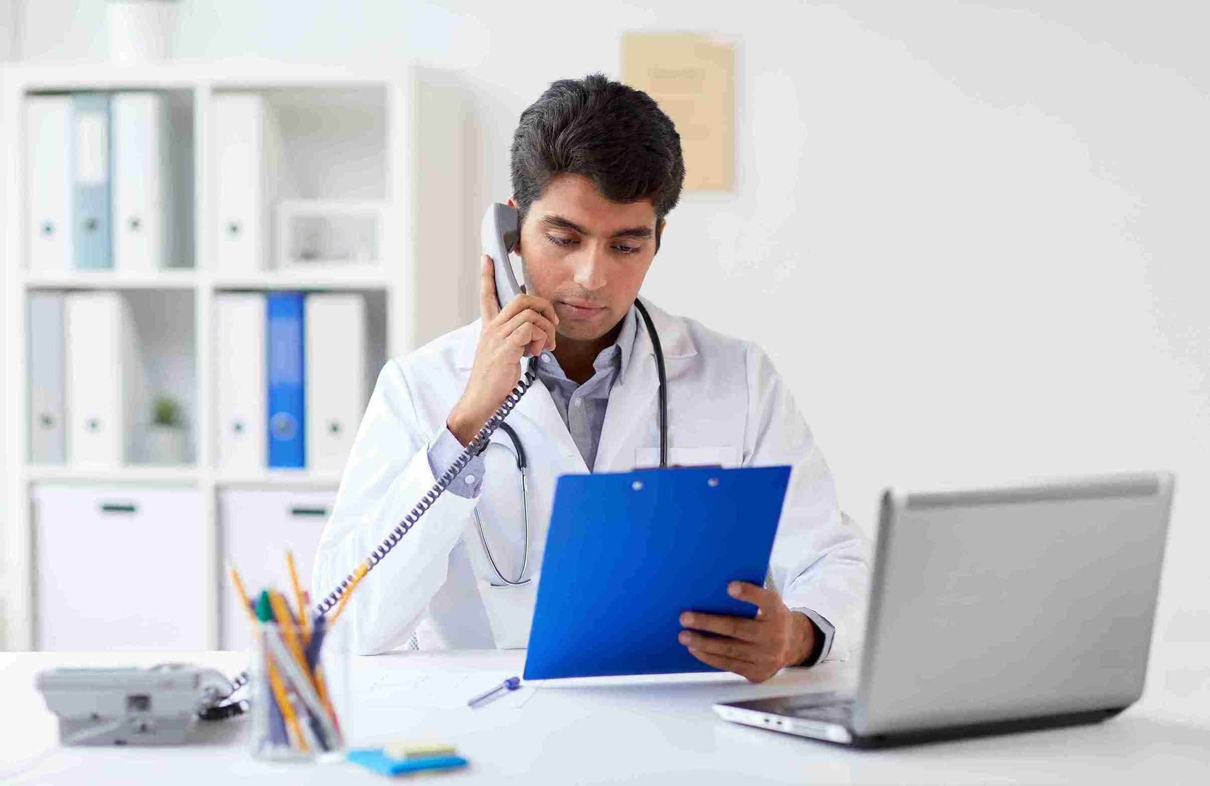 young doctor consulting medicines checking the patient's health report